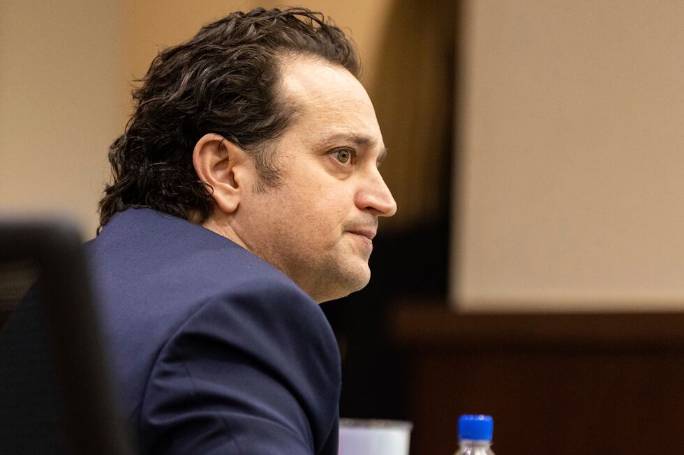 FILE - Charlie Adelson looks at jurors as his defense attorney presents closing arguments,...