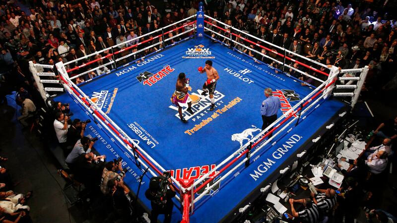 In this Jan. 19, 2019, file photo, Manny Pacquiao, center right, fights Adrien Broner in a WBA...