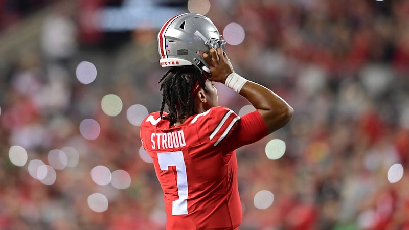 Ohio State quarterback C.J. Stroud puts on his helmet during the second quarter of an NCAA...