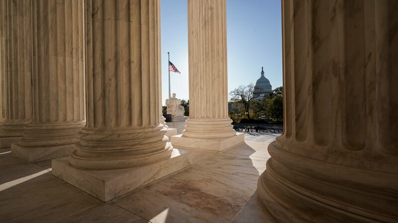 FILE - The Supreme Court is seen in Washington, with the U.S. Capitol in the distance, Nov. 4,...