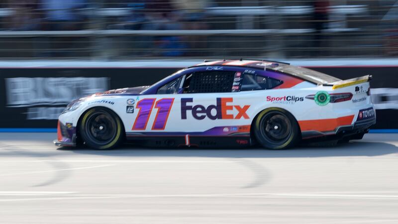 Denny Hamlin competes in a NASCAR Cup Series auto race at Texas Motor Speedway in Fort Worth,...